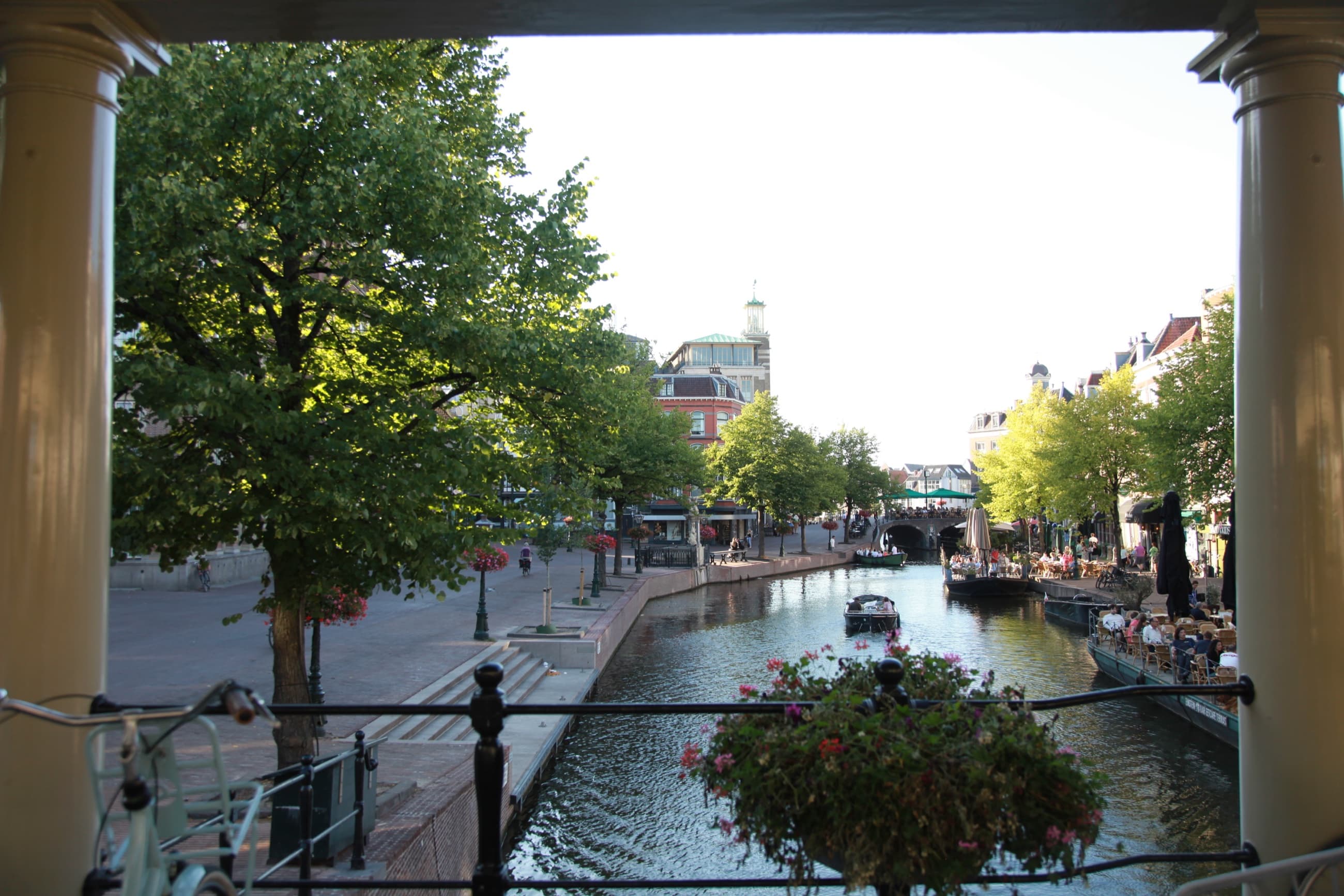 Canal view framed by a bridge in Leiden