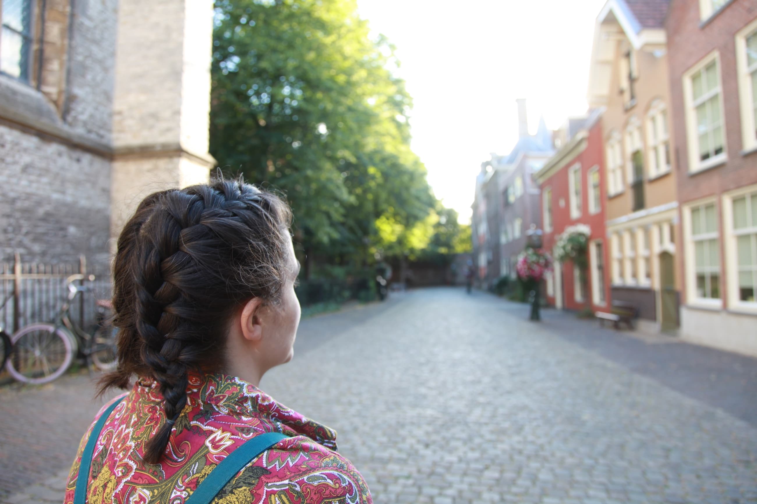 Traveller looking along a historic street in Leiden
