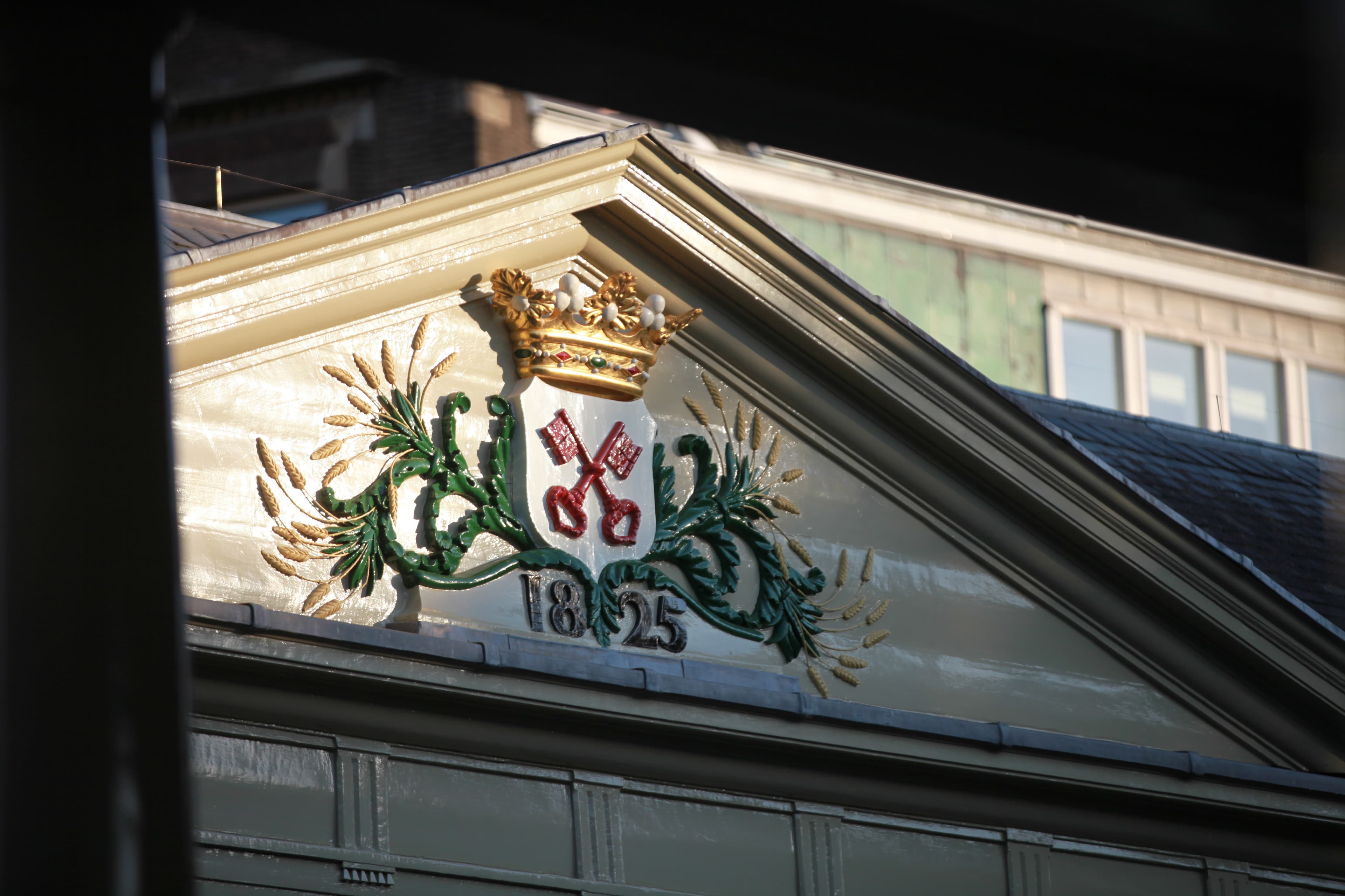 Close view of Leiden's crossed-keys crest in warm light