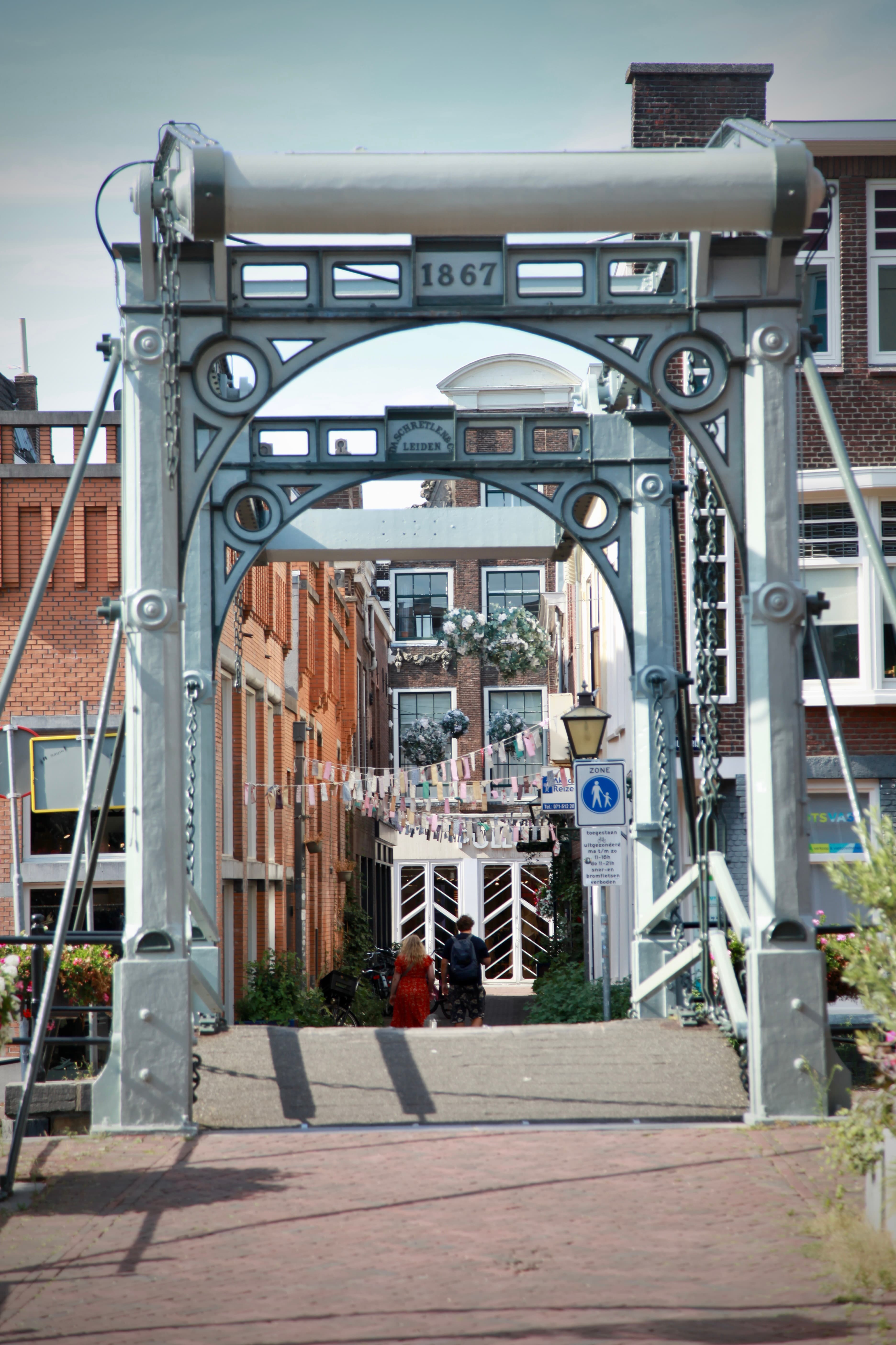 View through an ornate historic metal bridge structure in Leiden