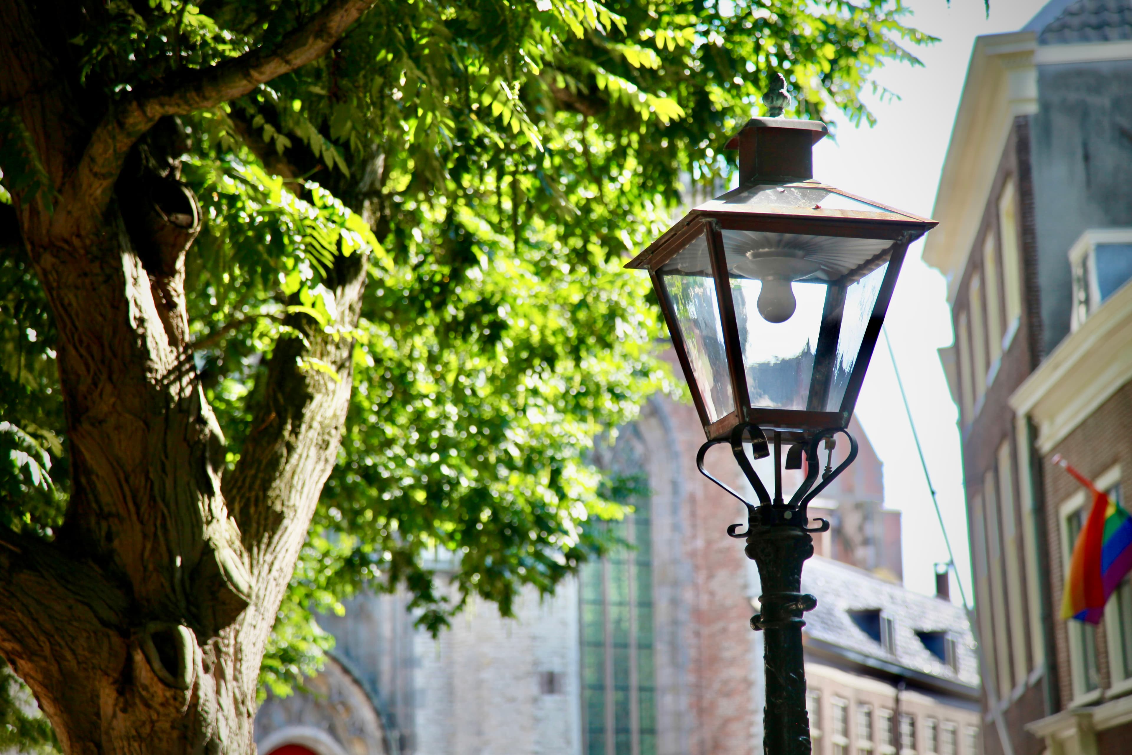 Historic street lantern with Pieterskerk beyond
