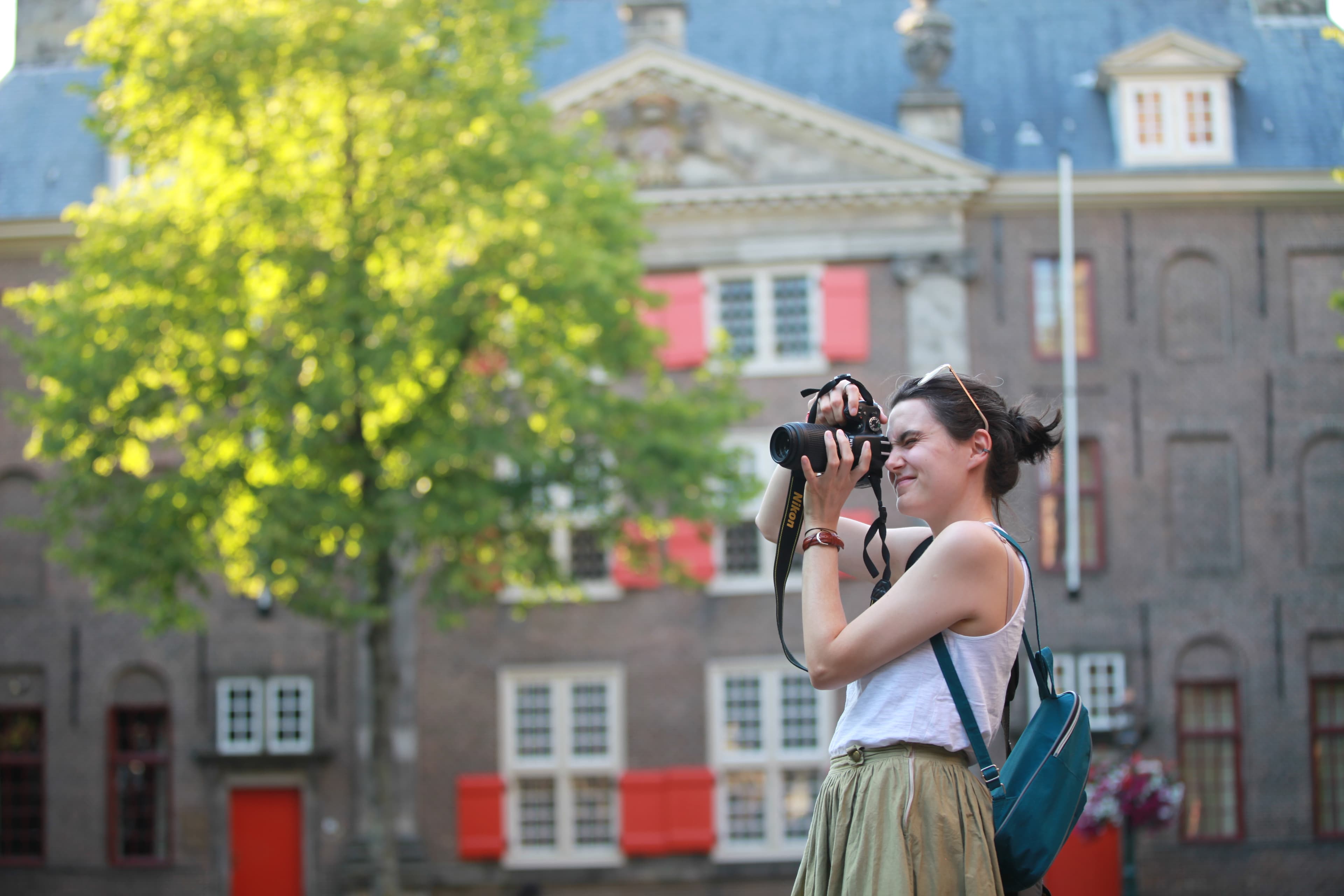 A photographer composing a historic Leiden courtyard