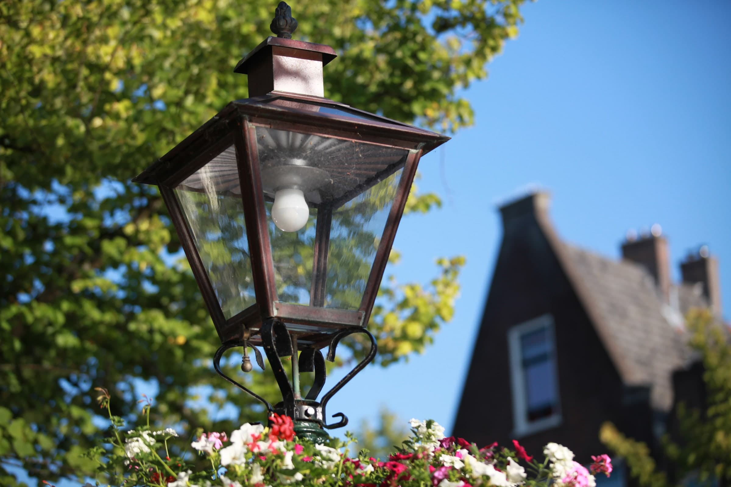 Historic street lantern in sunlight in Leiden