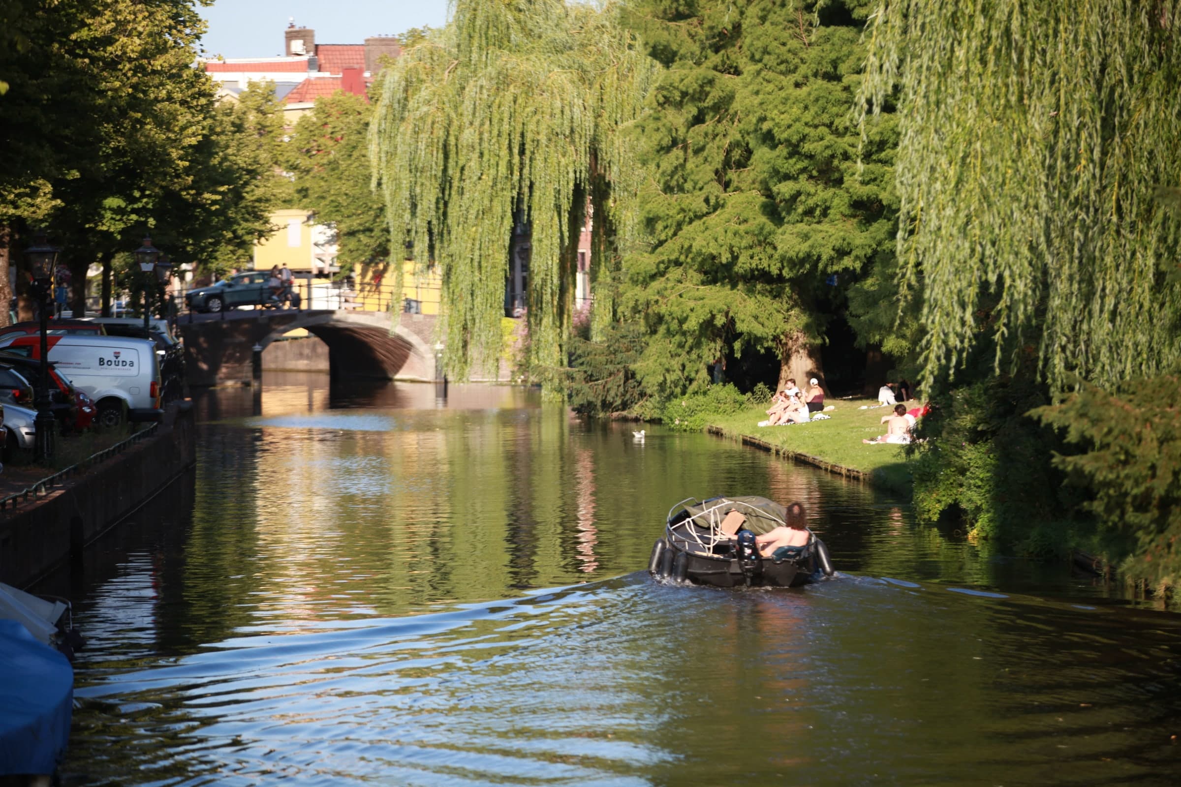 Rowboat and willow reflections in Leiden