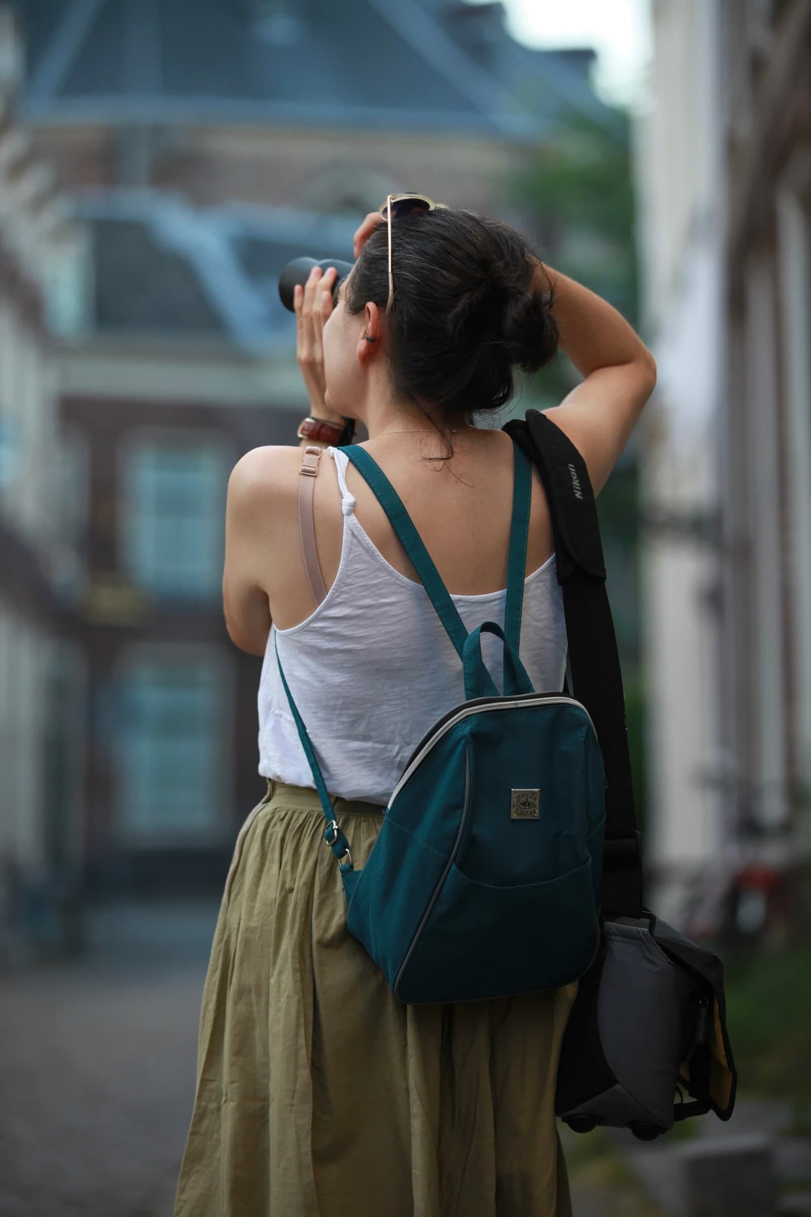 Photographer composing in a historic square in Leiden