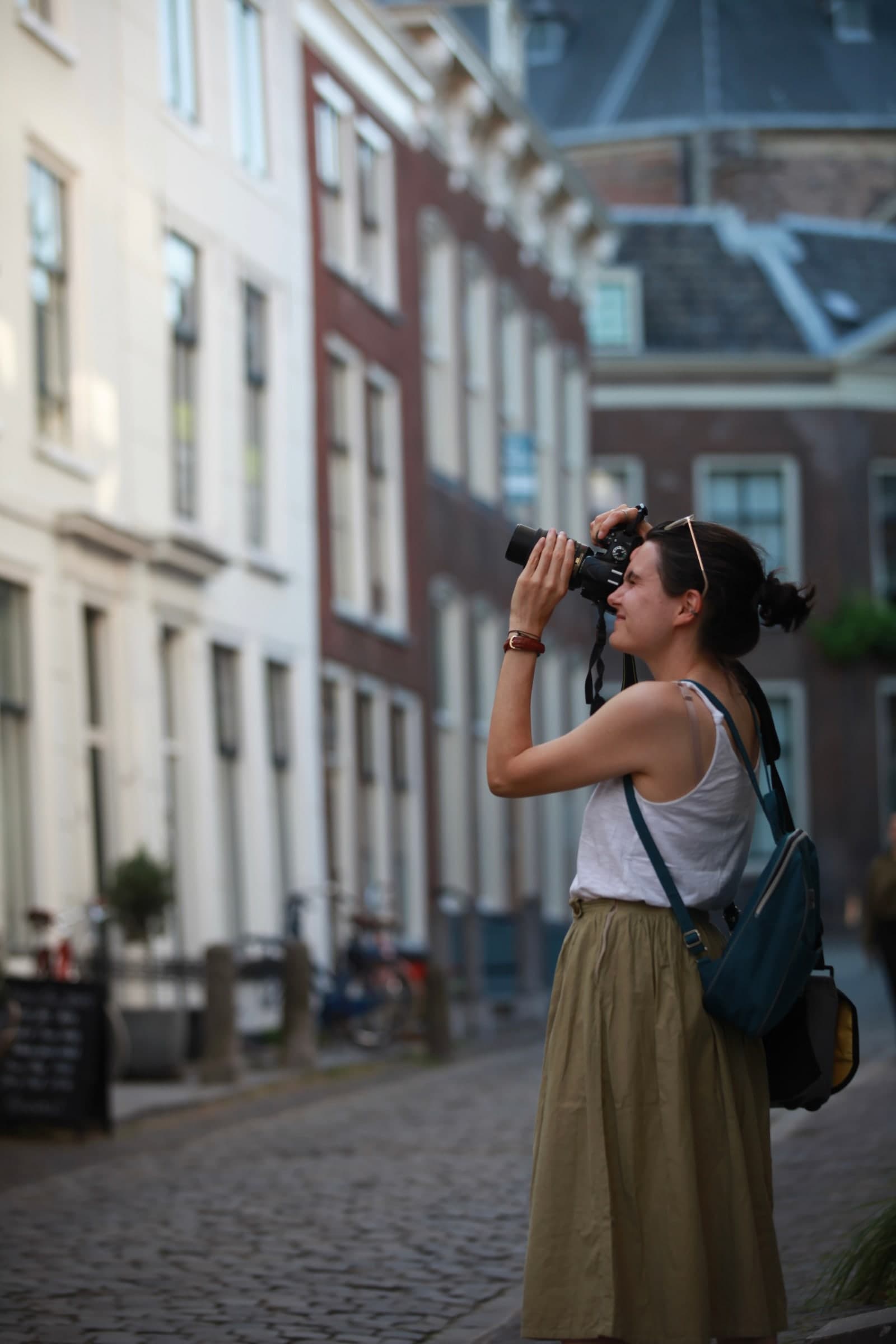 Photographer raising her camera in Leiden