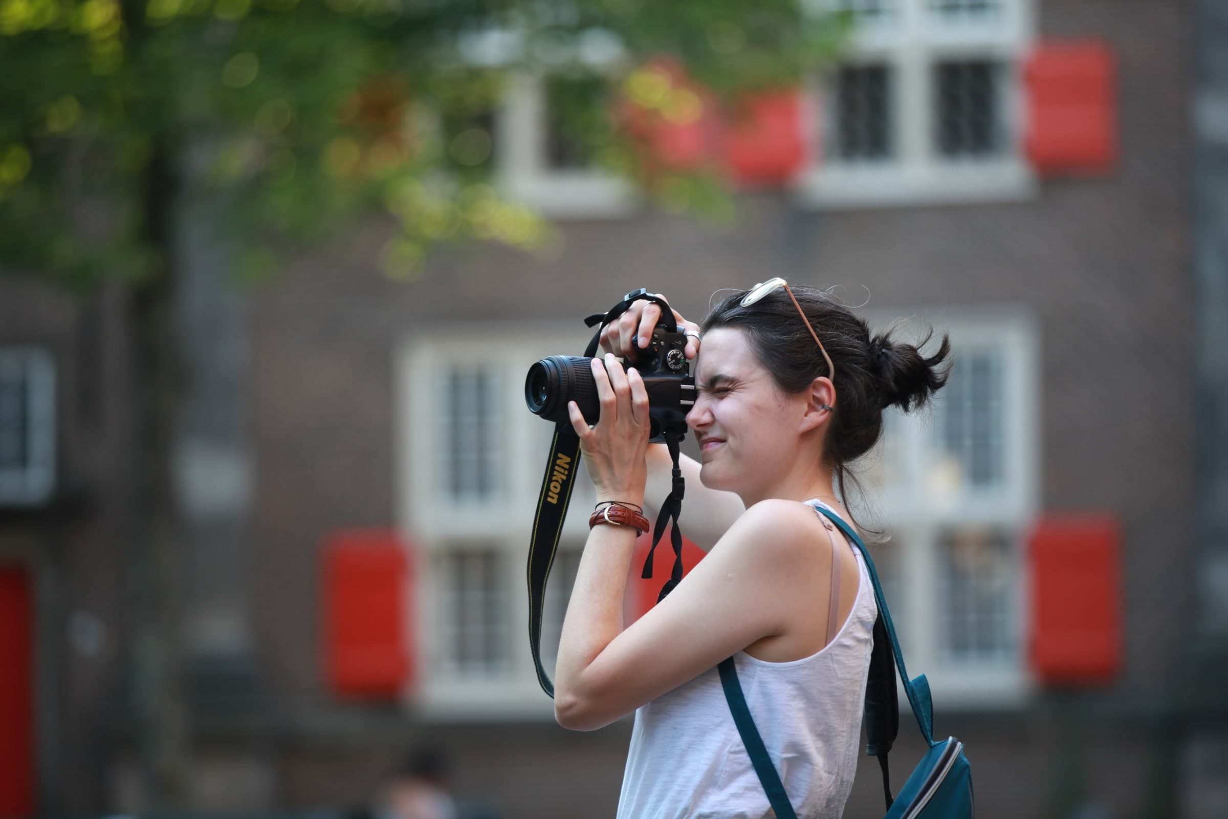 Photographer composing in a historic square in Leiden