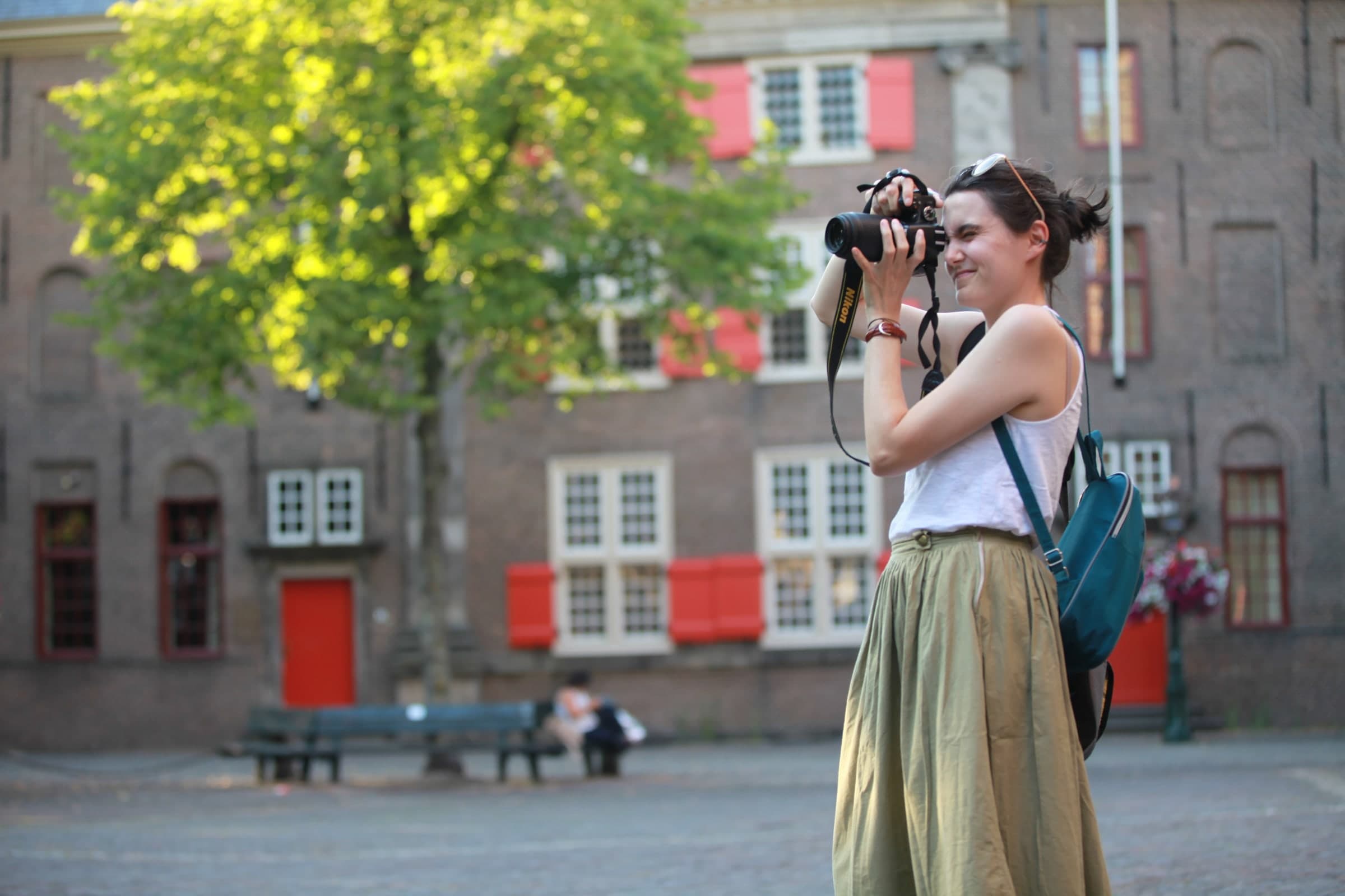 Photographer in a sunlit square in Leiden