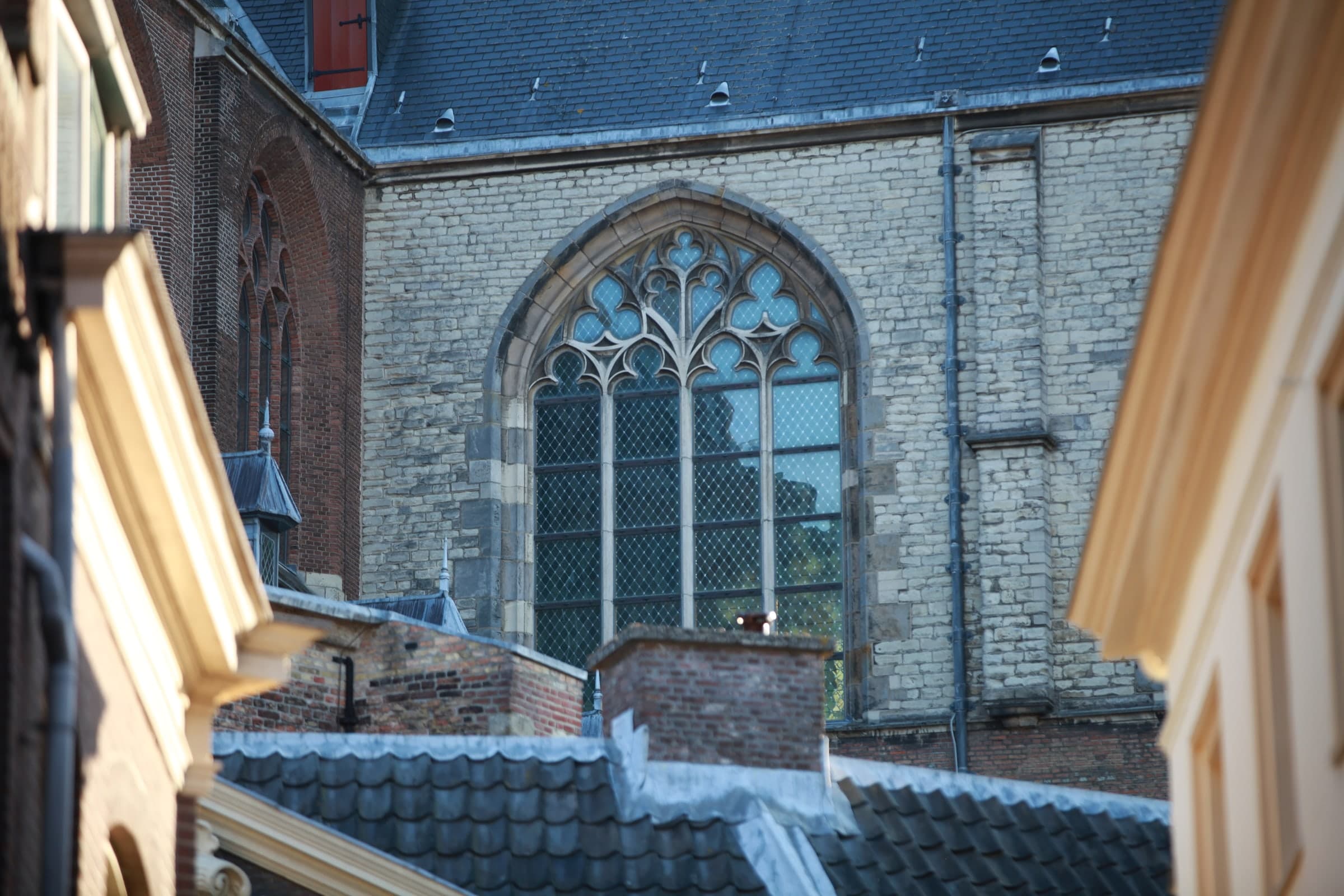 Gothic church across the rooftops in Leiden