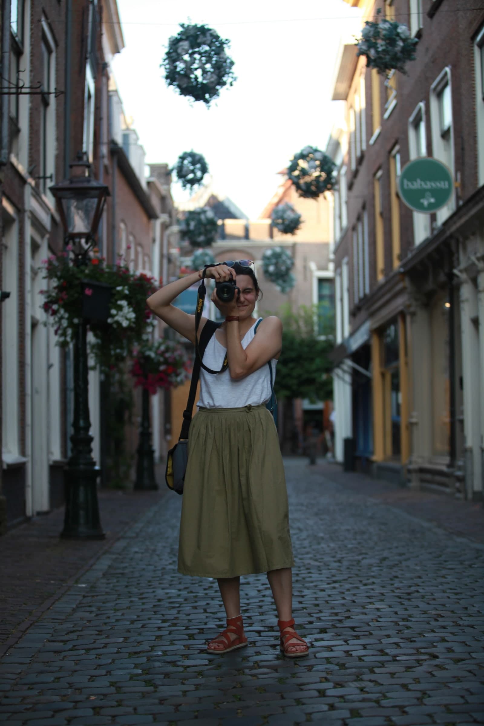 Photographer composing down a street in Leiden