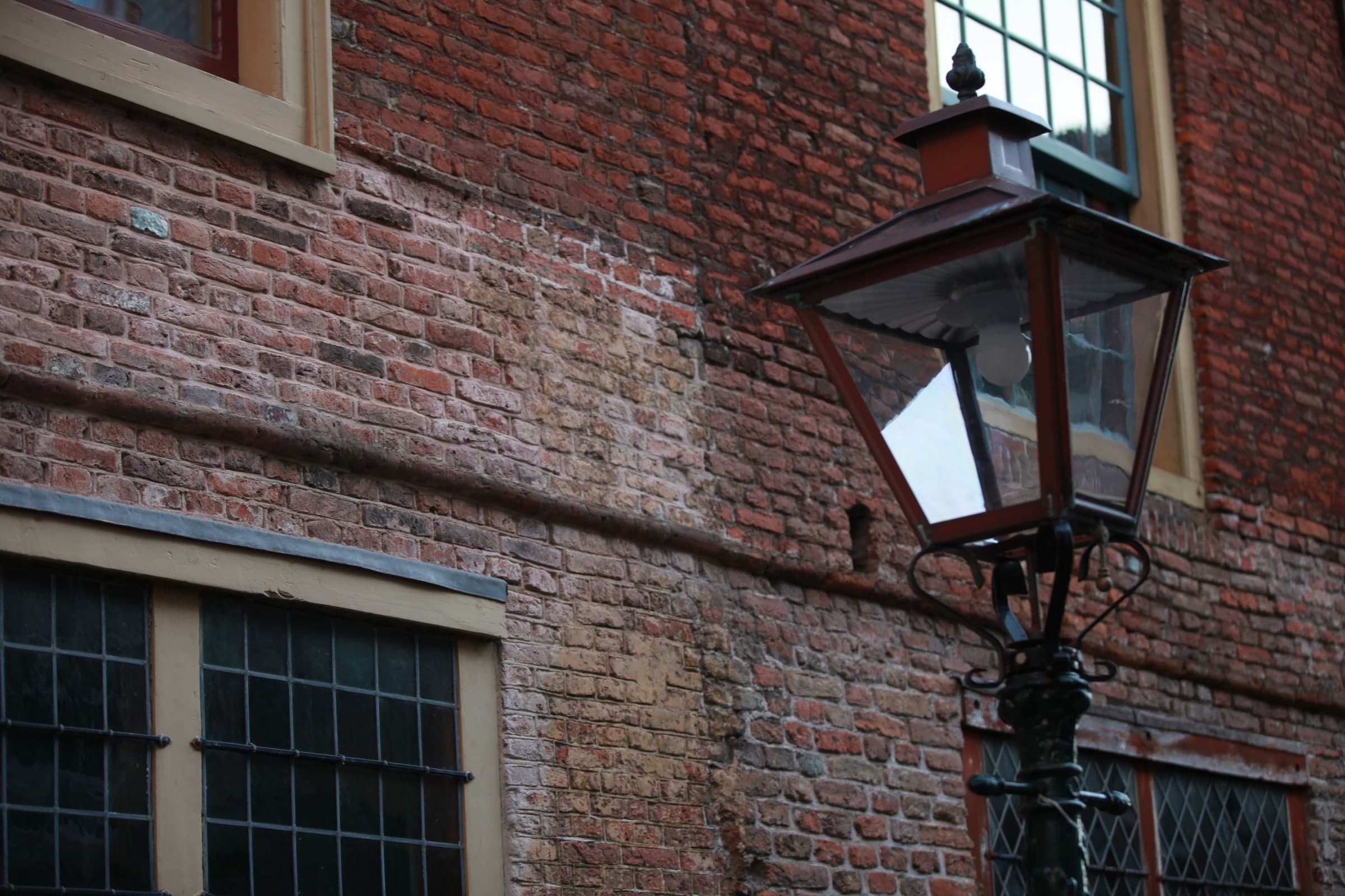 Lantern against historic brick in Leiden