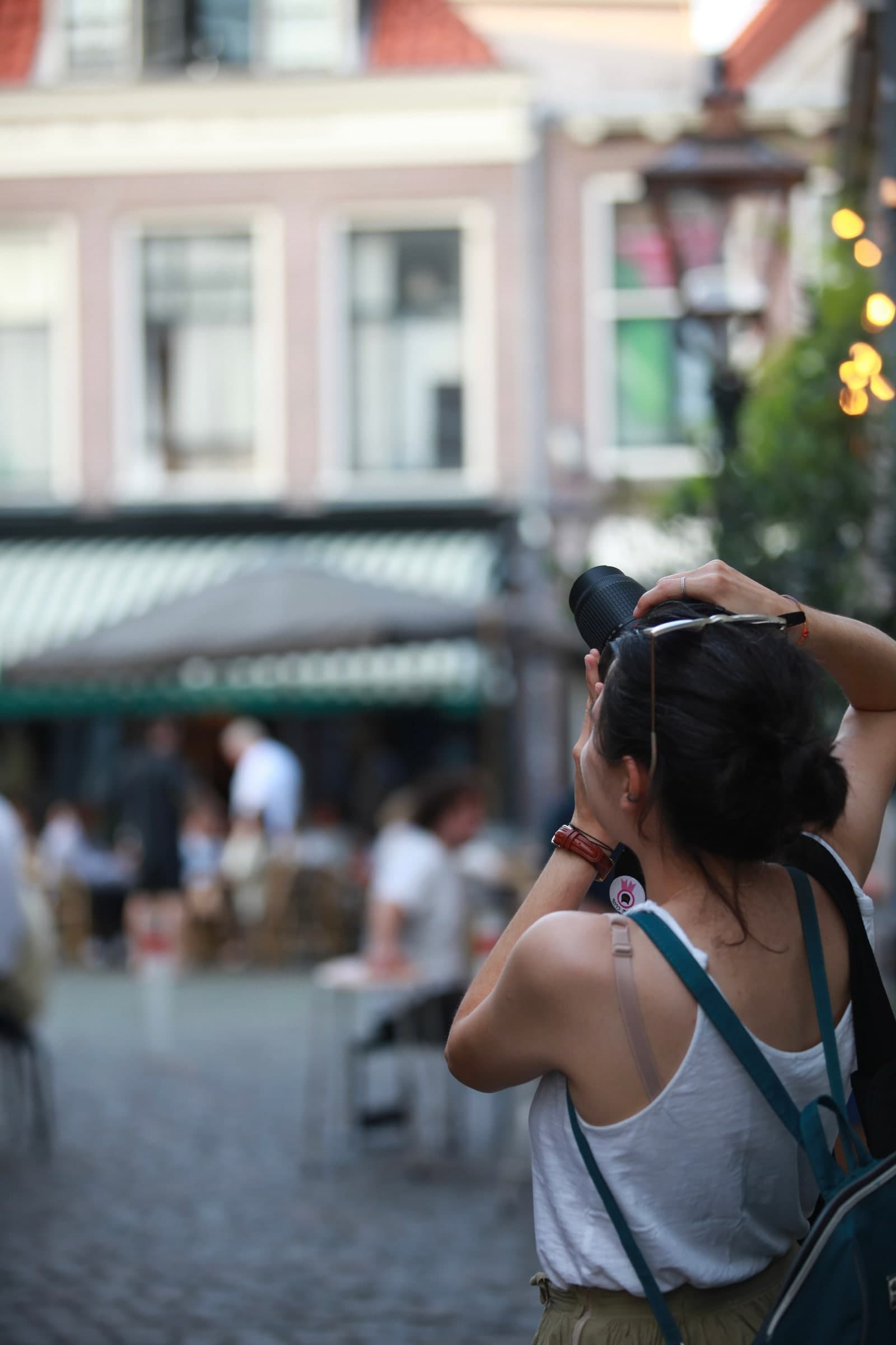 Photographer framing a lively square in Leiden