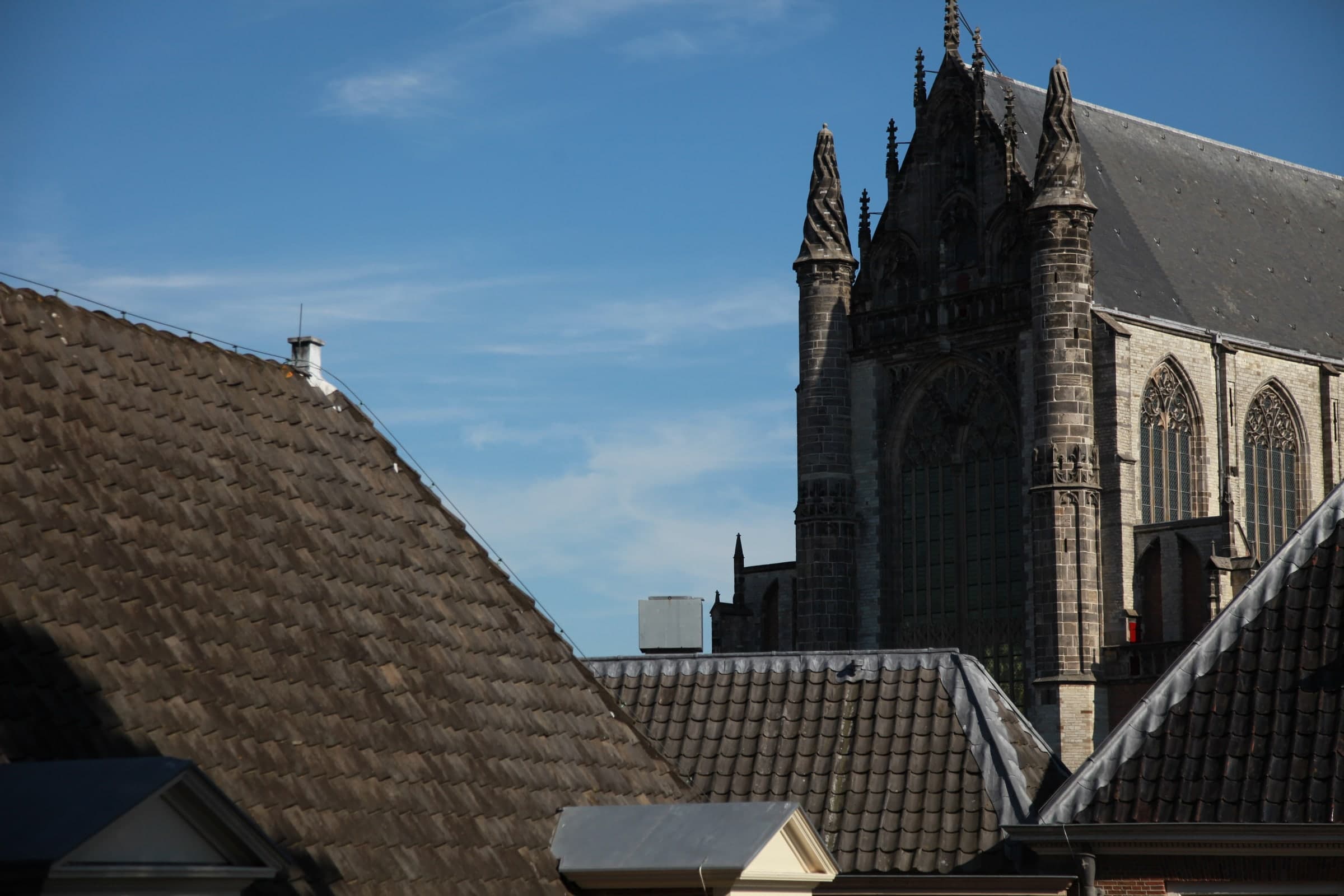 Gothic church above rooftops in Leiden