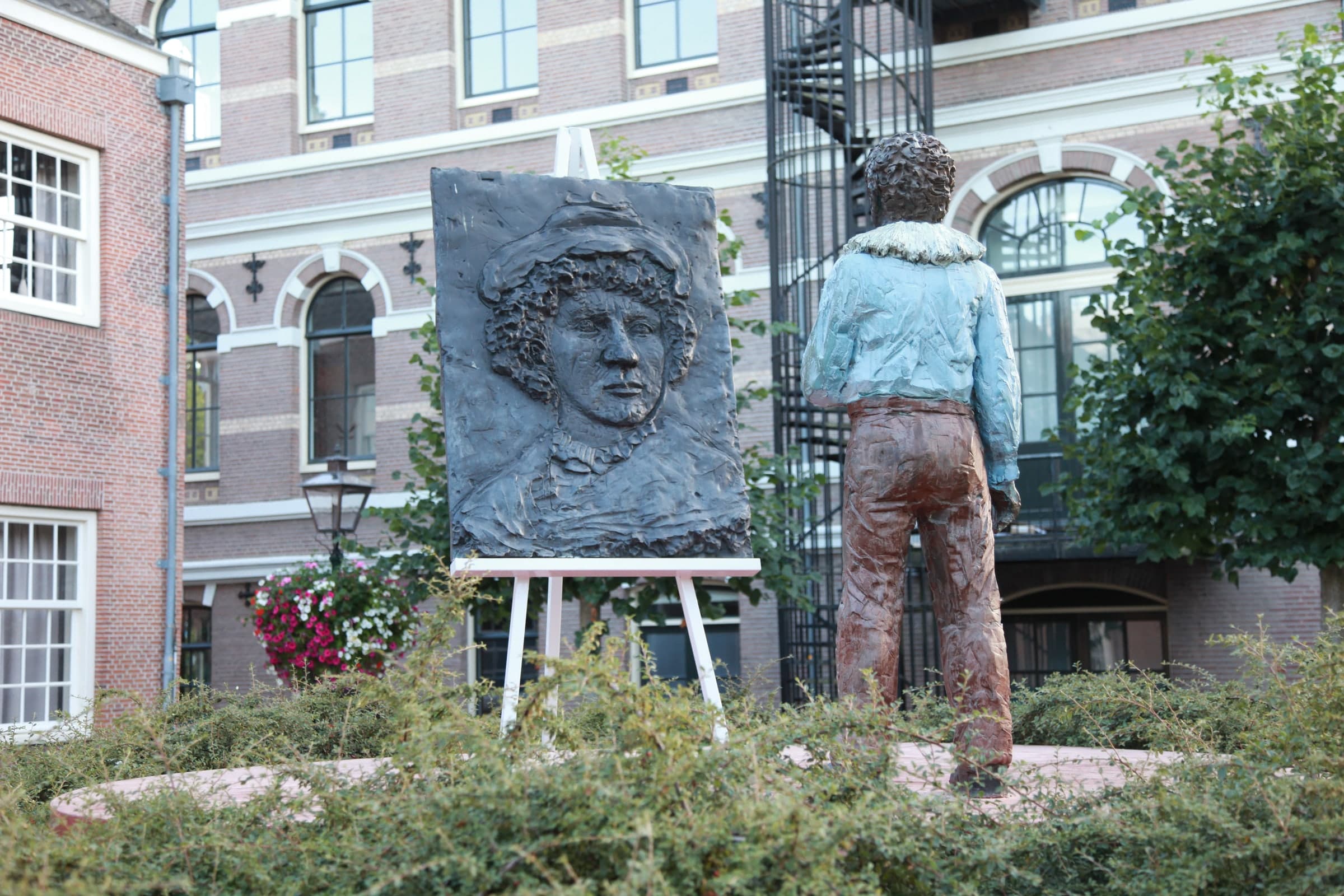 Sculptor beside a portrait bust in Leiden