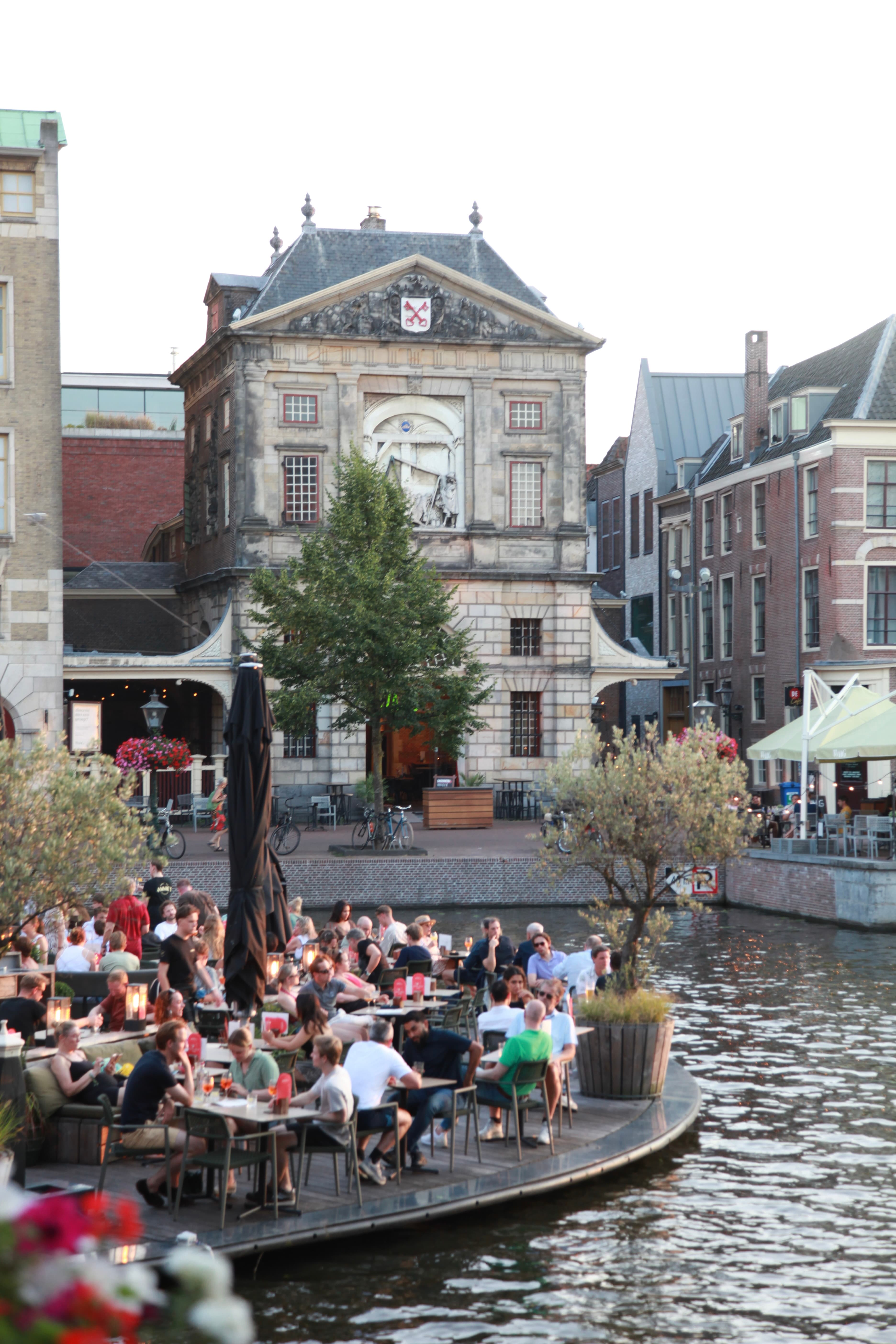 Lively canal-side café terraces in historic Leiden